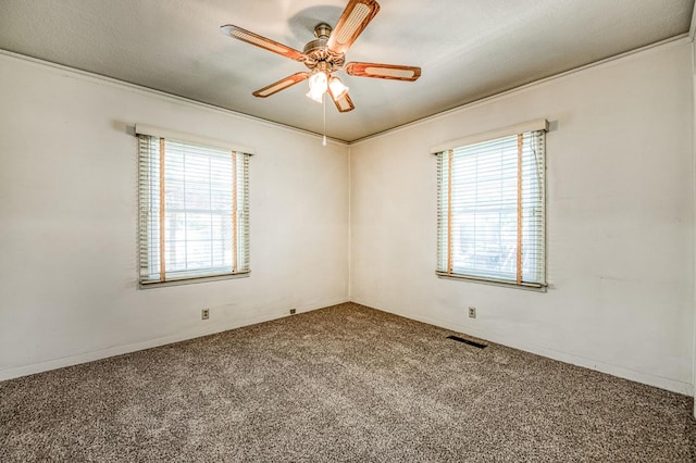 4740 E Washington Ave, Fresno, CA 93702 - empty room featuring plenty of natural light, carpet floors, ceiling fan, and ornamental molding