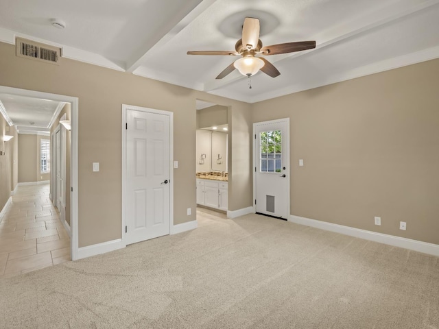 8147 N Cedar Unit 116, Fresno, CA 93720 - unfurnished bedroom featuring multiple windows, light carpet, connected bathroom, and ceiling fan