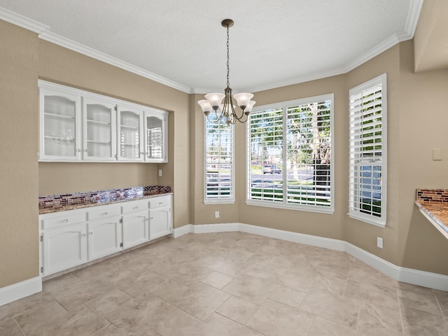 8147 N Cedar Unit 116, Fresno, CA 93720 - unfurnished dining area featuring ornamental molding, a chandelier, and a textured ceiling