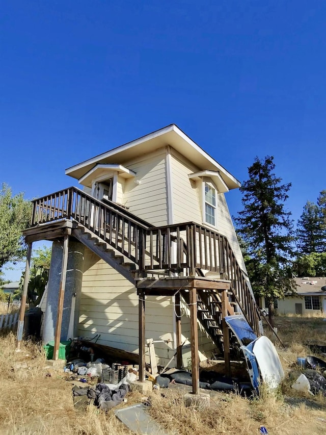 10220 E Tulare Ave, Sanger, CA 93657 - view of side of home featuring stairs and a deck