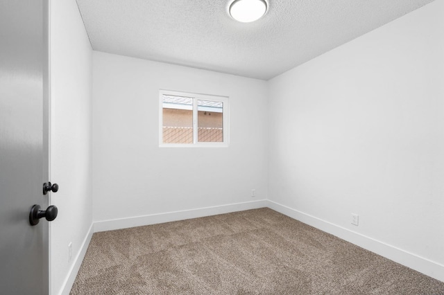 145 W Atchison Ave, Fresno, CA 93706 - carpeted empty room featuring a textured ceiling and baseboards