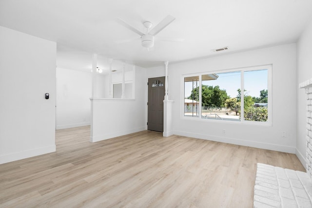 145 W Atchison Ave, Fresno, CA 93706 - unfurnished living room with a ceiling fan and light wood-style floors