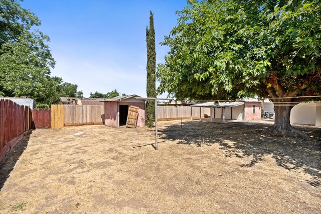 145 W Atchison Ave, Fresno, CA 93706 - fenced backyard featuring a shed