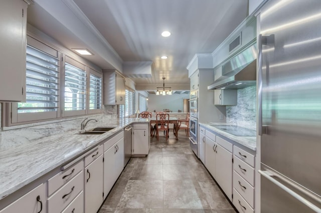 5679 N Van Ness Blvd, Fresno, CA 93711 - kitchen featuring appliances with stainless steel finishes, backsplash, crown molding, white cabinets, and recessed lighting