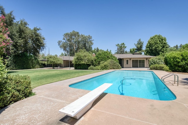 5679 N Van Ness Blvd, Fresno, CA 93711 - outdoor pool with a diving board, an exterior structure, a lawn, an outdoor structure, and a patio