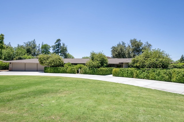 5679 N Van Ness Blvd, Fresno, CA 93711 - view of front of house featuring a front lawn and driveway