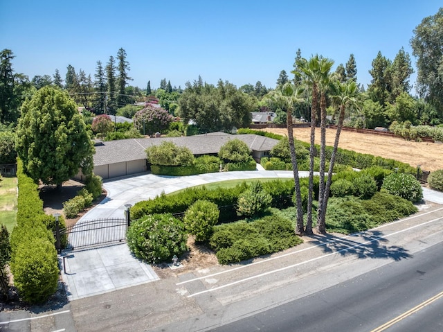 5679 N Van Ness Blvd, Fresno, CA 93711 - view of property's community with a gate and view of wooded area