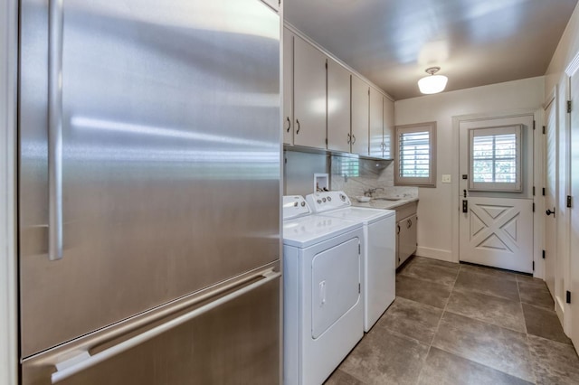 5679 N Van Ness Blvd, Fresno, CA 93711 - laundry room with cabinet space and washing machine and dryer