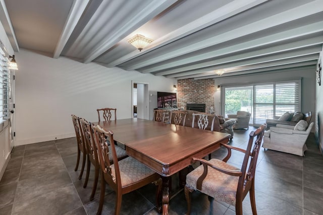 5679 N Van Ness Blvd, Fresno, CA 93711 - dining room with beam ceiling and a fireplace