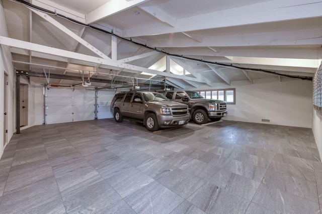 5679 N Van Ness Blvd, Fresno, CA 93711 - parking deck featuring a garage door opener