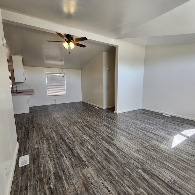 12015 E Shaw Ave, Clovis, CA 93619 - unfurnished living room featuring dark wood-style flooring, a ceiling fan, and lofted ceiling