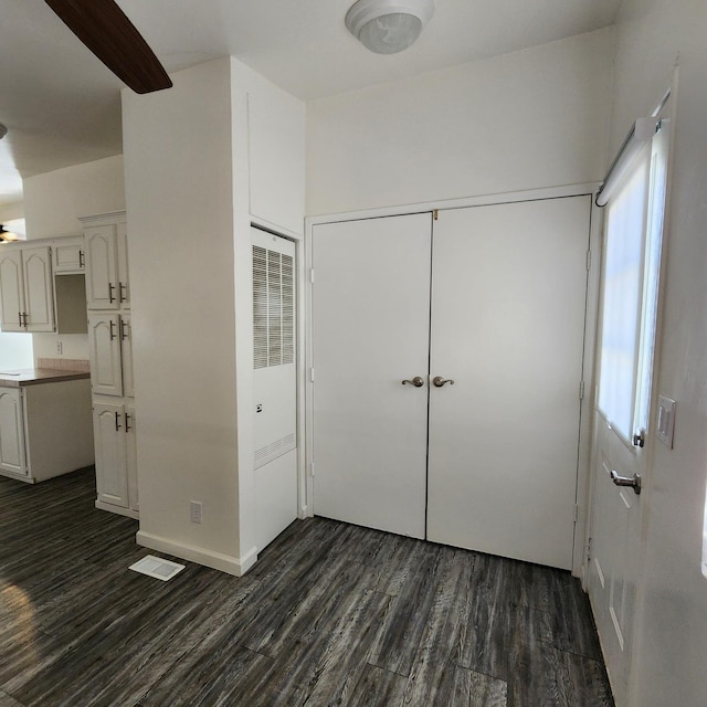 12015 E Shaw Ave, Clovis, CA 93619 - unfurnished bedroom with dark wood-type flooring, a heating unit, and a closet