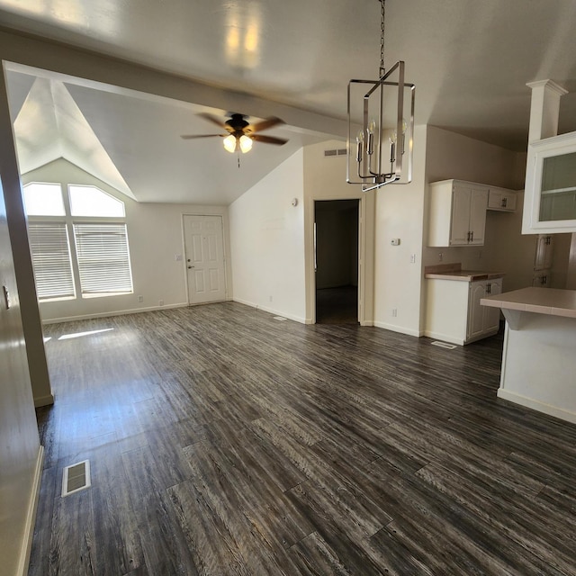 12015 E Shaw Ave, Clovis, CA 93619 - unfurnished living room with vaulted ceiling, a ceiling fan, dark wood-style flooring, and a chandelier