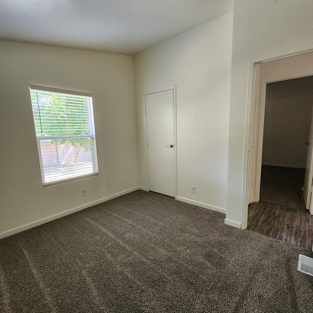 12015 E Shaw Ave, Clovis, CA 93619 - spare room with dark colored carpet and baseboards