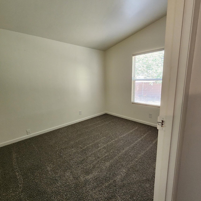 12015 E Shaw Ave, Clovis, CA 93619 - empty room featuring vaulted ceiling and dark carpet