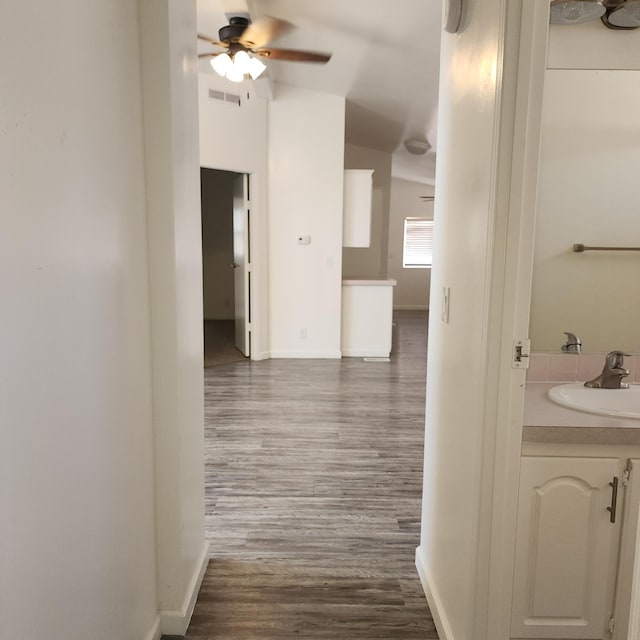 12015 E Shaw Ave, Clovis, CA 93619 - corridor with wood finished floors and vaulted ceiling