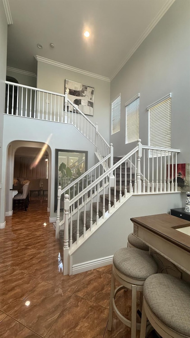 5335 E Hoxie Ave, Fresno, CA 93725 - staircase featuring arched walkways and crown molding