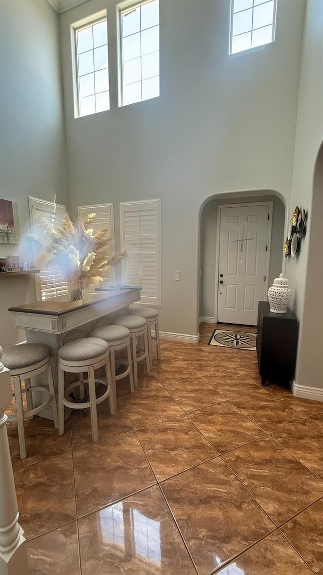 5335 E Hoxie Ave, Fresno, CA 93725 - foyer entrance featuring a towering ceiling, arched walkways, and plenty of natural light