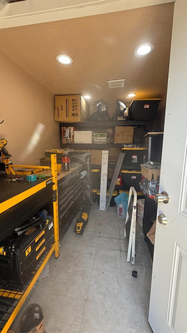 5335 E Hoxie Ave, Fresno, CA 93725 - garage featuring a workshop area and recessed lighting