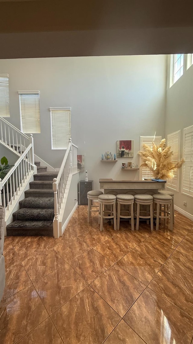 5335 E Hoxie Ave, Fresno, CA 93725 - dining area featuring a towering ceiling and stairs