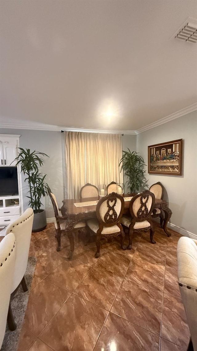 5335 E Hoxie Ave, Fresno, CA 93725 - dining room featuring ornamental molding and tile patterned floors