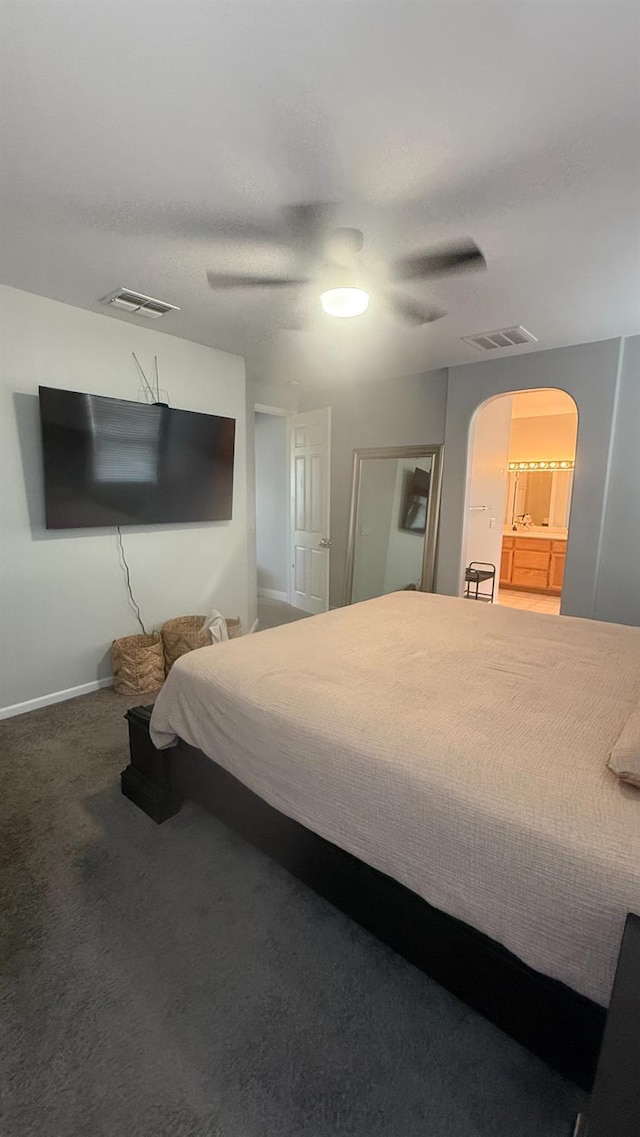 5335 E Hoxie Ave, Fresno, CA 93725 - bedroom with arched walkways, carpet flooring, and ceiling fan