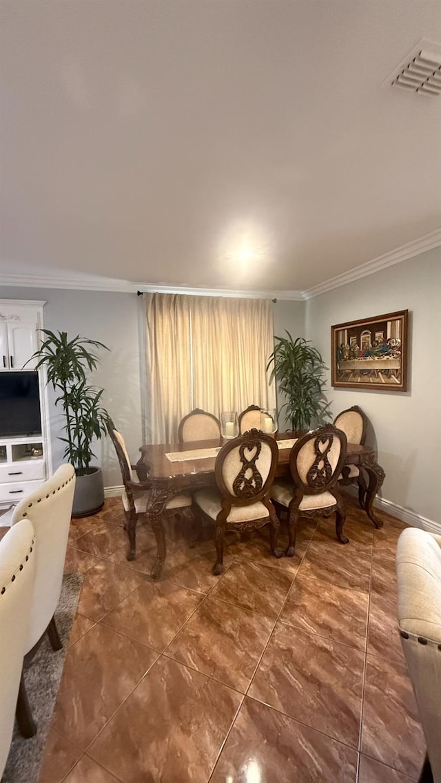 5335 E Hoxie Ave, Fresno, CA 93725 - dining area featuring crown molding and tile patterned floors
