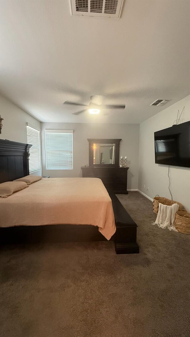 5335 E Hoxie Ave, Fresno, CA 93725 - carpeted bedroom with ceiling fan and baseboards