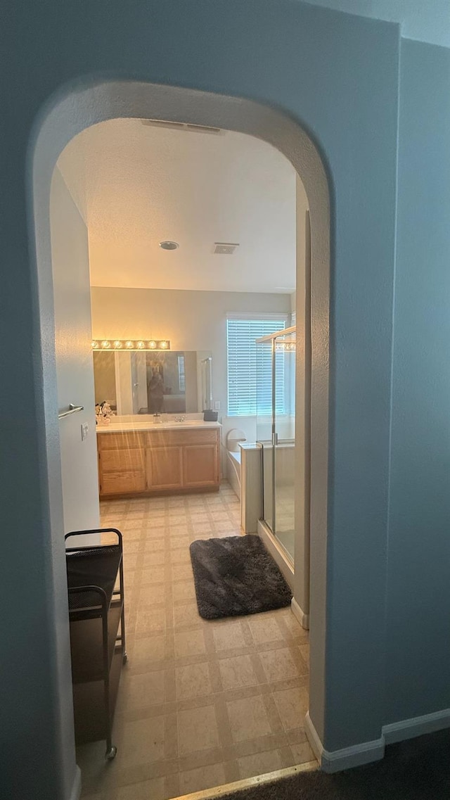 5335 E Hoxie Ave, Fresno, CA 93725 - full bathroom with a shower stall, tile patterned floors, double vanity, and a bath