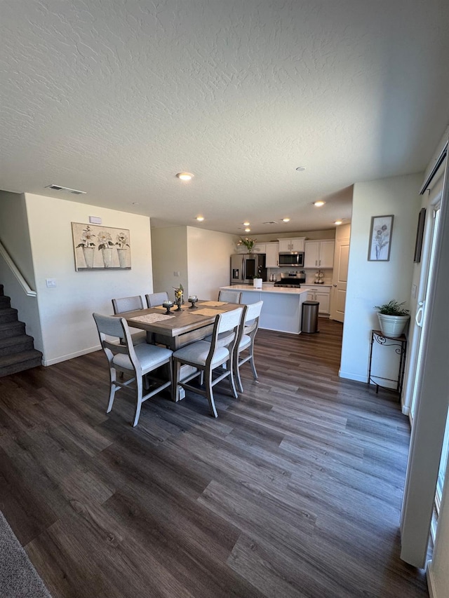 1905 George Ave, Sanger, CA 93657 - dining space featuring stairs, dark wood finished floors, recessed lighting, and a textured ceiling