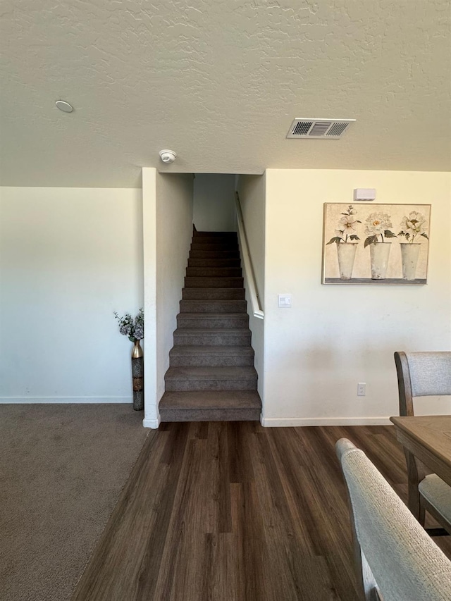 1905 George Ave, Sanger, CA 93657 - staircase with wood finished floors and a textured ceiling