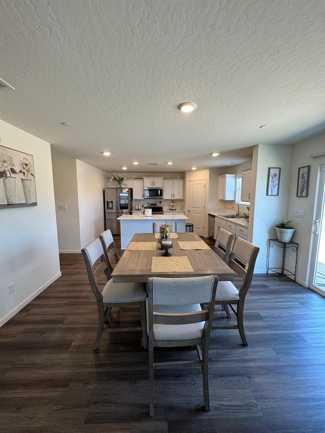 1905 George Ave, Sanger, CA 93657 - dining room with a textured ceiling, dark wood finished floors, and recessed lighting