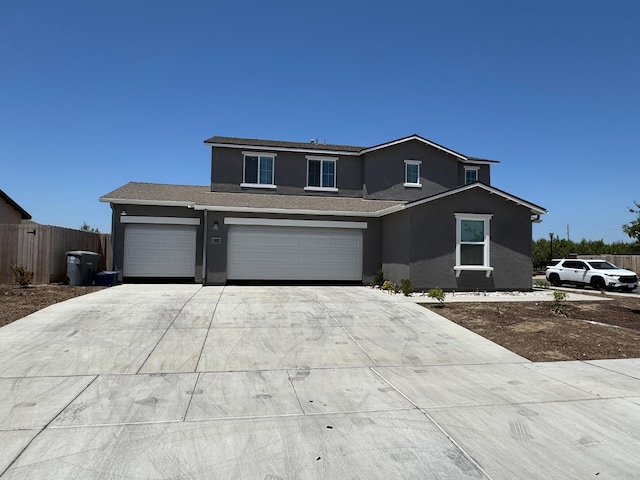 1905 George Ave, Sanger, CA 93657 - traditional-style home with stucco siding, driveway, and a garage