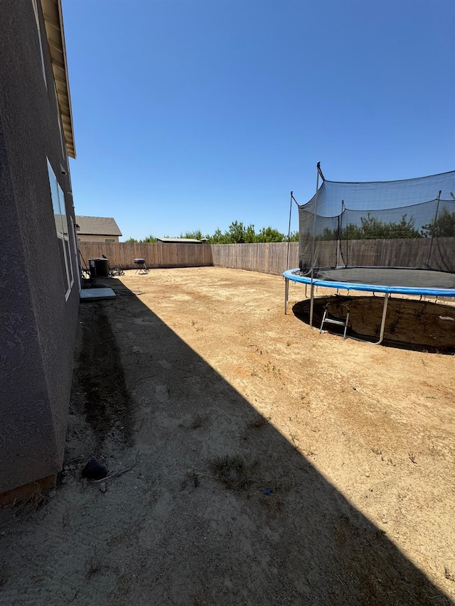 1905 George Ave, Sanger, CA 93657 - fenced backyard with a trampoline