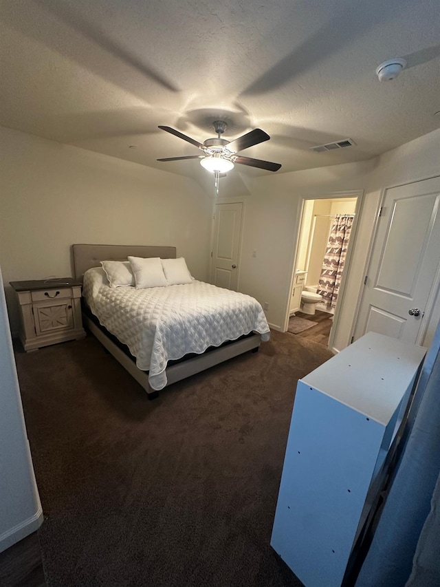 1905 George Ave, Sanger, CA 93657 - bedroom featuring dark carpet, a ceiling fan, connected bathroom, and a textured ceiling