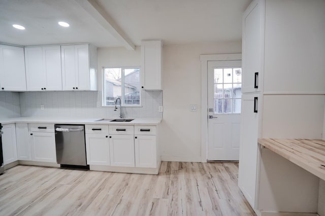 1530 E Home Ave, Fresno, CA 93728 - kitchen featuring stainless steel dishwasher, light wood finished floors, decorative backsplash, healthy amount of natural light, and beam ceiling