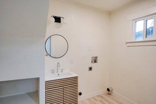 1530 E Home Ave, Fresno, CA 93728 - laundry room featuring hookup for an electric dryer, light wood-style flooring, and washer hookup