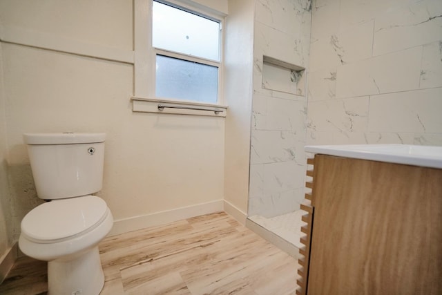 1530 E Home Ave, Fresno, CA 93728 - full bathroom with walk in shower, wood finished floors, and vanity