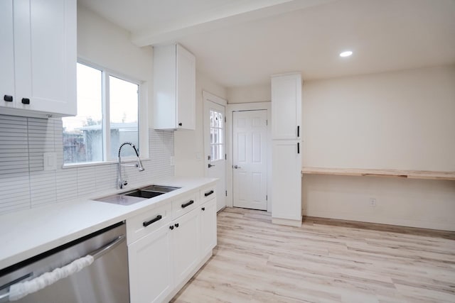 1530 E Home Ave, Fresno, CA 93728 - kitchen featuring dishwasher, tasteful backsplash, light countertops, white cabinets, and light wood-style floors