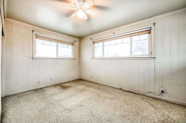 3303 E Mono Ave, Fresno, CA 93702 - unfurnished room featuring ceiling fan, carpet flooring, and wooden walls