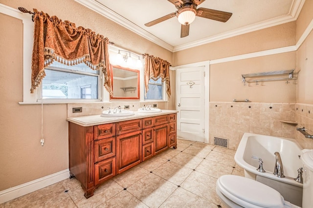 3303 E Mono Ave, Fresno, CA 93702 - bathroom with double vanity, a bath, a ceiling fan, ornamental molding, and tile patterned flooring