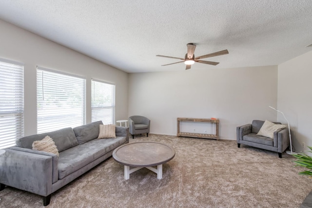 4245 N Manila Ave, Fresno, CA 93727 - living area with a ceiling fan, a textured ceiling, and carpet