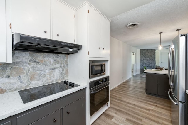 4245 N Manila Ave, Fresno, CA 93727 - kitchen with black appliances, under cabinet range hood, gray cabinets, white cabinetry, and a textured ceiling