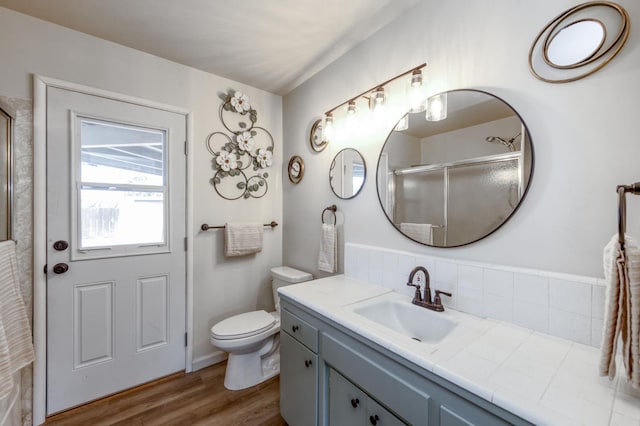 4245 N Manila Ave, Fresno, CA 93727 - bathroom with vanity, wood finished floors, and a shower with shower door