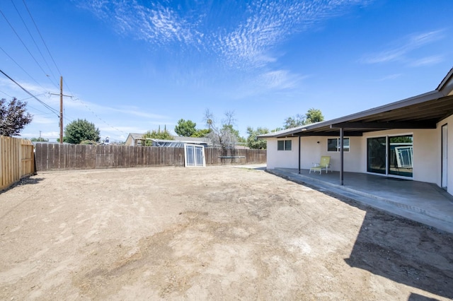 4245 N Manila Ave, Fresno, CA 93727 - fenced backyard with a patio area