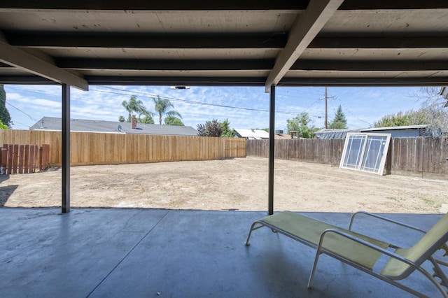4245 N Manila Ave, Fresno, CA 93727 - fenced backyard with a patio area and an outdoor structure