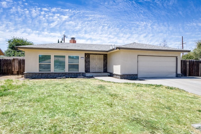 4245 N Manila Ave, Fresno, CA 93727 - single story home featuring an attached garage, concrete driveway, a chimney, stone siding, and stucco siding