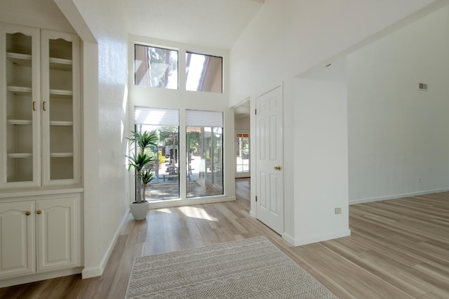 1535 S Homsy Ave, Fresno, CA 93727 - foyer entrance with light wood-style flooring and a towering ceiling
