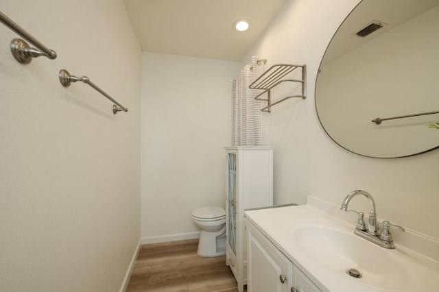1535 S Homsy Ave, Fresno, CA 93727 - bathroom with vanity, wood finished floors, and recessed lighting