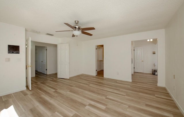 1535 S Homsy Ave, Fresno, CA 93727 - spare room featuring a ceiling fan, light wood finished floors, and a textured ceiling
